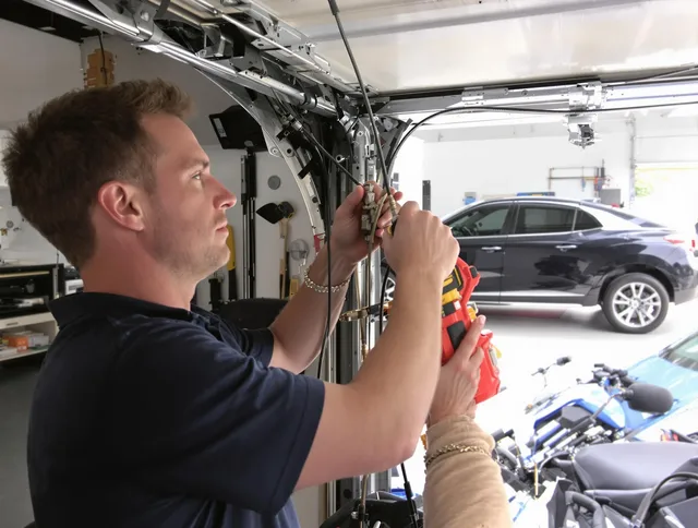 Mahoning Garage Door Repair safety certified technician performing cable replacement in Mahoning
