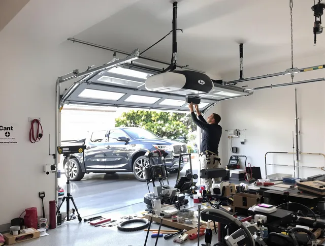 Mahoning Garage Door Repair specialist installing smart garage door opener system in Mahoning home