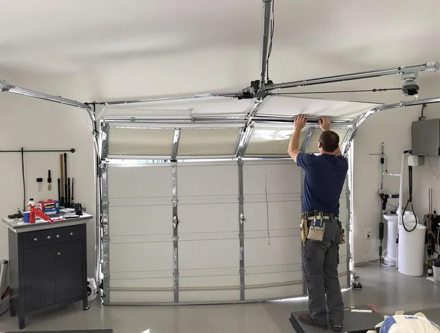 Mahoning Garage Door Repair specialist performing precise section replacement on Mahoning garage door